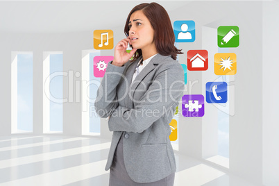 Composite image of worried businesswoman