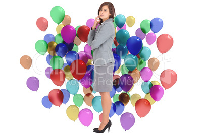 Composite image of worried businesswoman