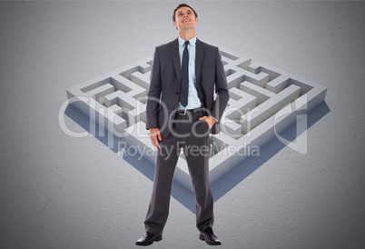 Composite image of happy businessman with hand in pocket