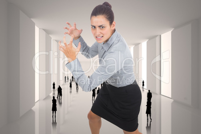 Composite image of furious businesswoman gesturing