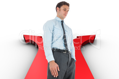 Composite image of serious businessman standing with hand in poc