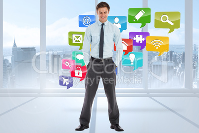 Composite image of smiling businessman standing with hands in po