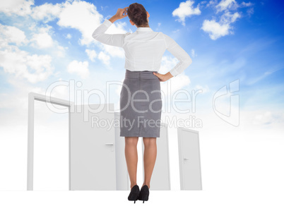 Composite image of businesswoman scratching her head