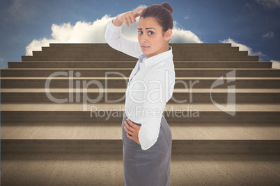 Composite image of worried businesswoman