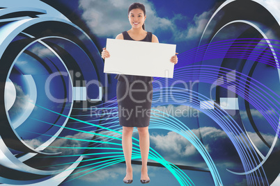 Composite image of businesswoman holding a placard