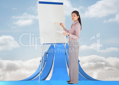 Composite image of businesswoman painting on an easel