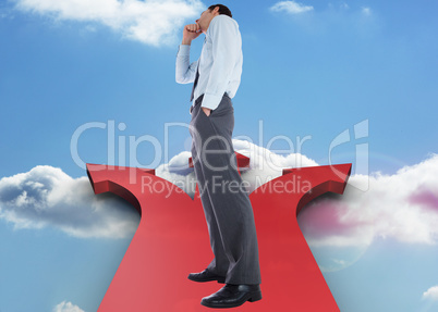 Composite image of thoughtful businessman with hand on chin