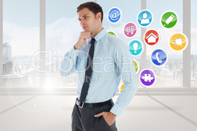 Composite image of thoughtful businessman with hand on chin