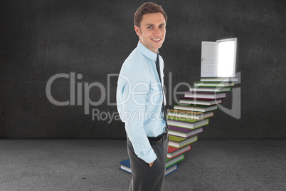 Composite image of happy businessman standing with hand in pocke