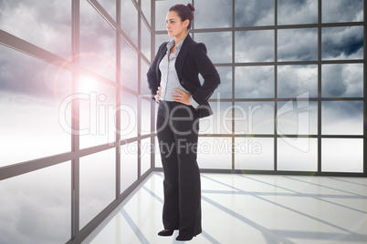 Composite image of serious businesswoman