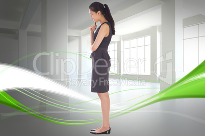 Composite image of thoughtful businesswoman