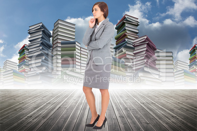 Composite image of worried businesswoman