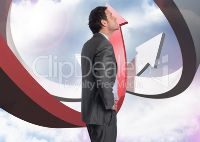 Composite image of smiling businessman with hand on hip