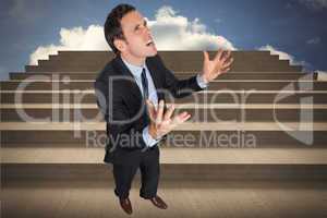 Composite image of stressed businessman gesturing