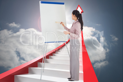 Composite image of businesswoman painting on an easel