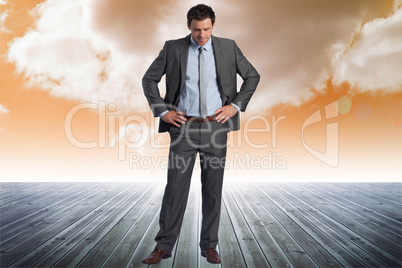 Composite image of smiling businessman with hands on hips Composite image of smiling businessman with hands on hips
