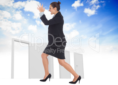 Composite image of angry businesswoman gesturing