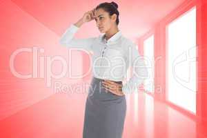 Composite image of focused businesswoman