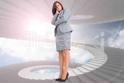 Composite image of focused businesswoman