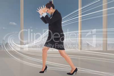 Composite image of angry businesswoman gesturing