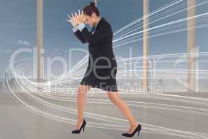 Composite image of angry businesswoman gesturing