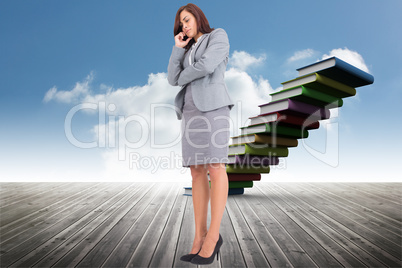 Composite image of focused businesswoman