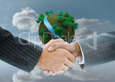 Composite image of business handshake