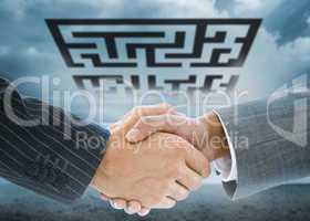 Composite image of business handshake