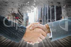 Composite image of business handshake