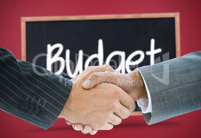 Composite image of business handshake