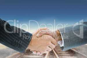 Composite image of business handshake