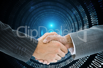 Composite image of business handshake