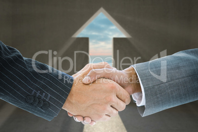 Composite image of business handshake