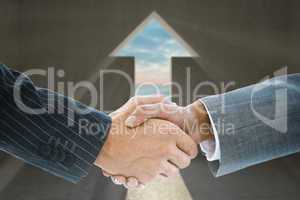 Composite image of business handshake