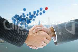 Composite image of business handshake