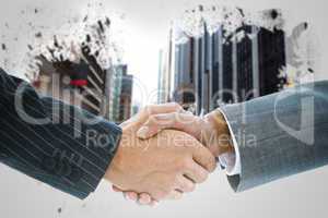 Composite image of business handshake