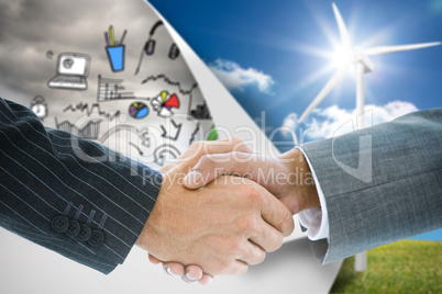 Composite image of business handshake