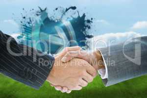 Composite image of business handshake