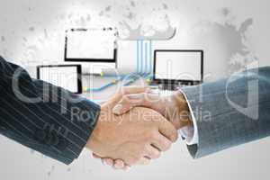 Composite image of business handshake