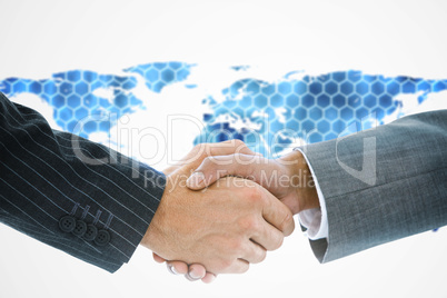 Composite image of business handshake