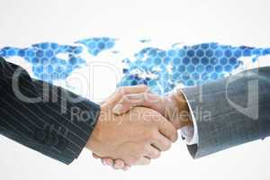 Composite image of business handshake