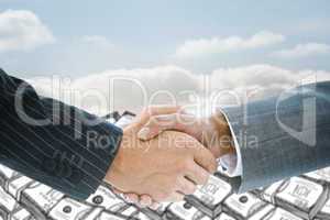 Composite image of business handshake