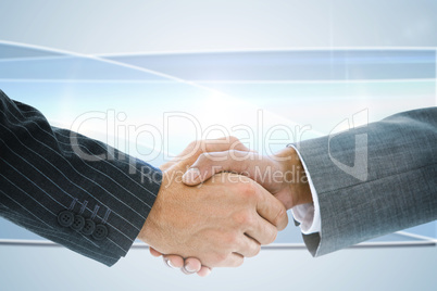 Composite image of business handshake