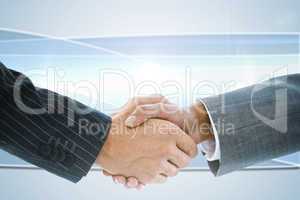 Composite image of business handshake