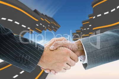 Composite image of business handshake