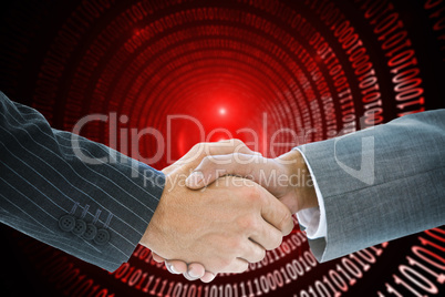 Composite image of business handshake