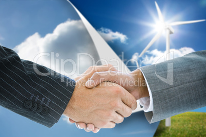 Composite image of business handshake