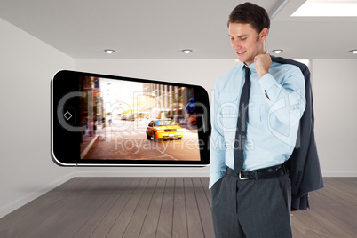 Composite image of smiling businessman holding his jacket