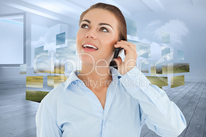 Composite image of smiling businesswoman looking upwards while o