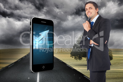 Composite image of thinking businessman holding pen